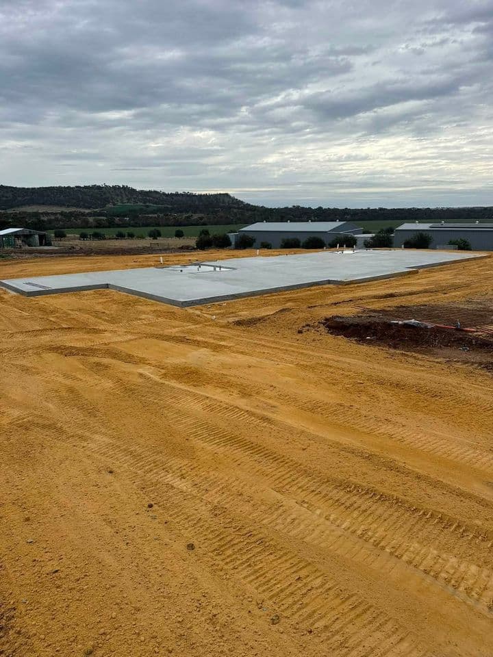 Large concrete slab formed and poured on a rural property