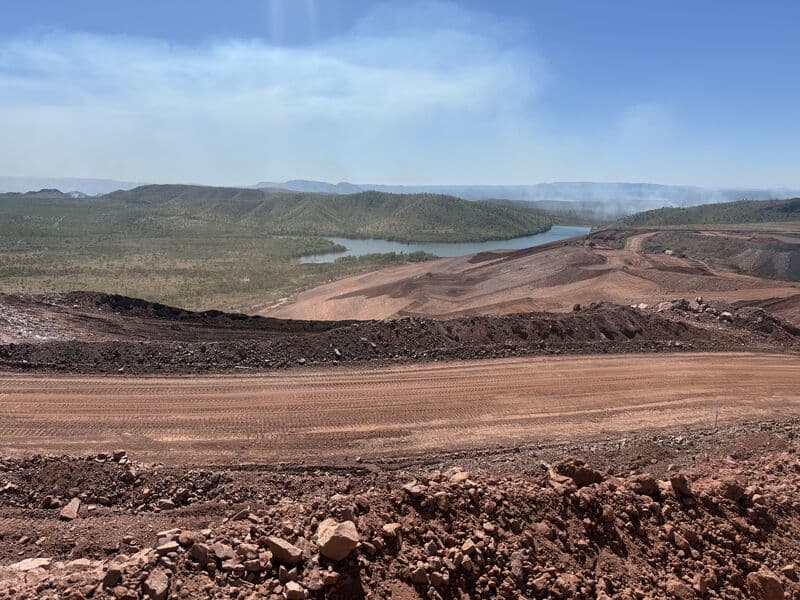 Haul road cut along a ridge above a river valley in WA