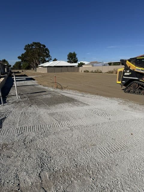 Skid steer excavating on a residential building site