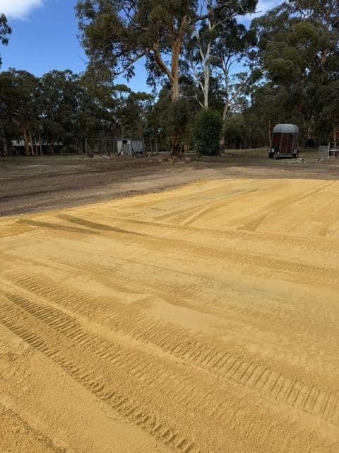 Skid steer working alongside a newly formed road verge